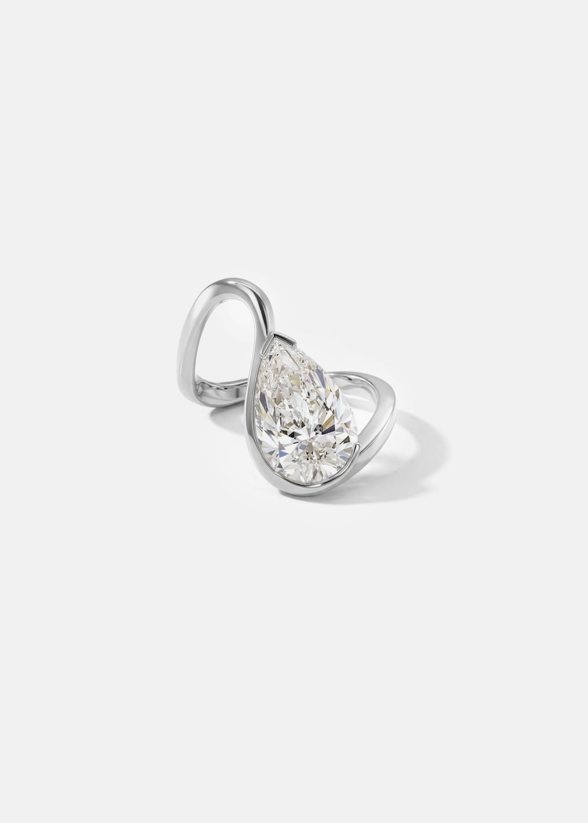 front view- 18k white gold trace band with a floating pear cut diamond