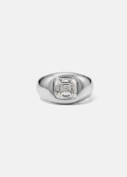 A 18k white gold signet ring featuring a large, bezel-set asscher cut diamond, against a clean background.