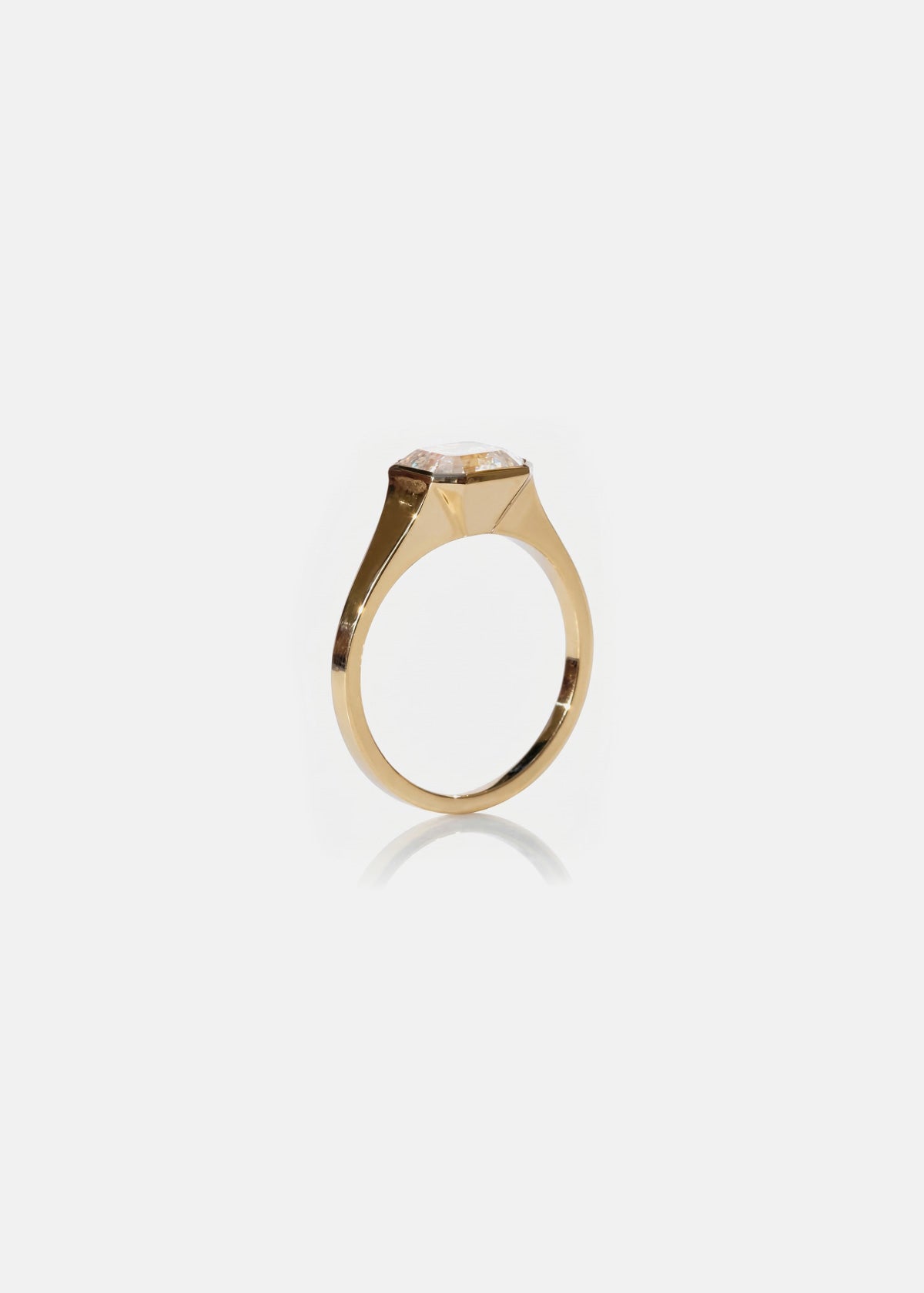 18k yellow gold tapering gold band - with a bezel set asscher cut diamond-side view