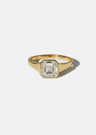 18k yellow gold tapering gold band - with a bezel set asscher cut diamond 