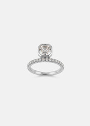 18k white gold engagement ring with a suspended floating asscher cut diamond and half pavé band