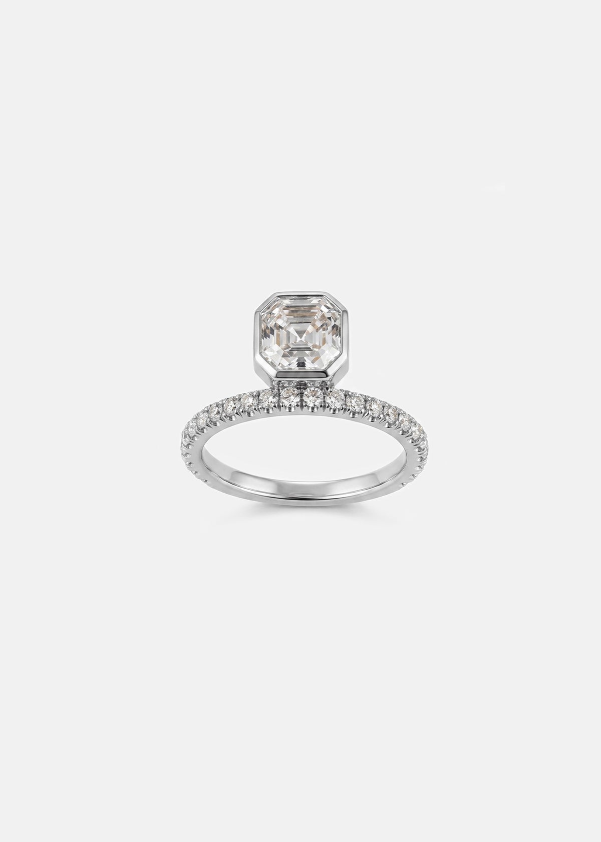 18k white gold engagement ring with a suspended floating asscher cut diamond and half pavé band