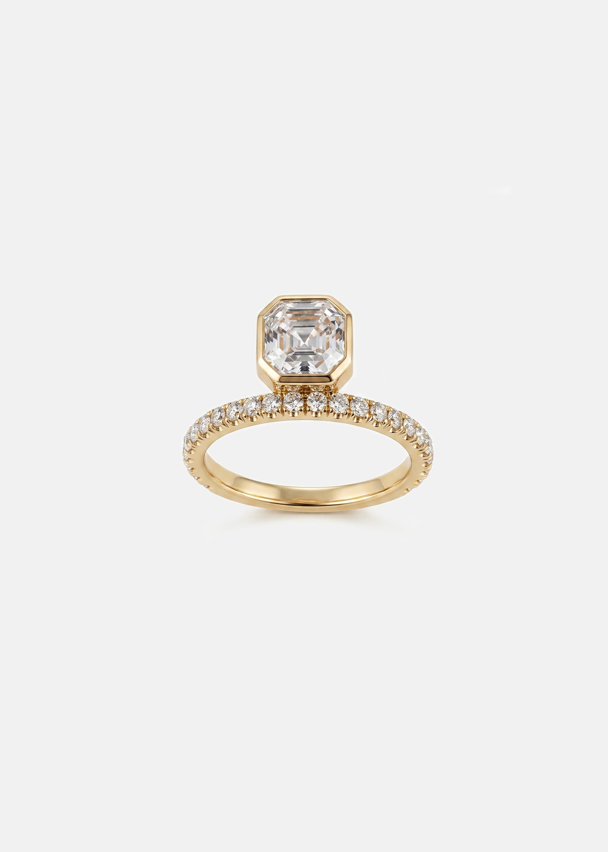 18k yellow gold engagement ring with a suspended floating asscher cut diamond and half pavé band
