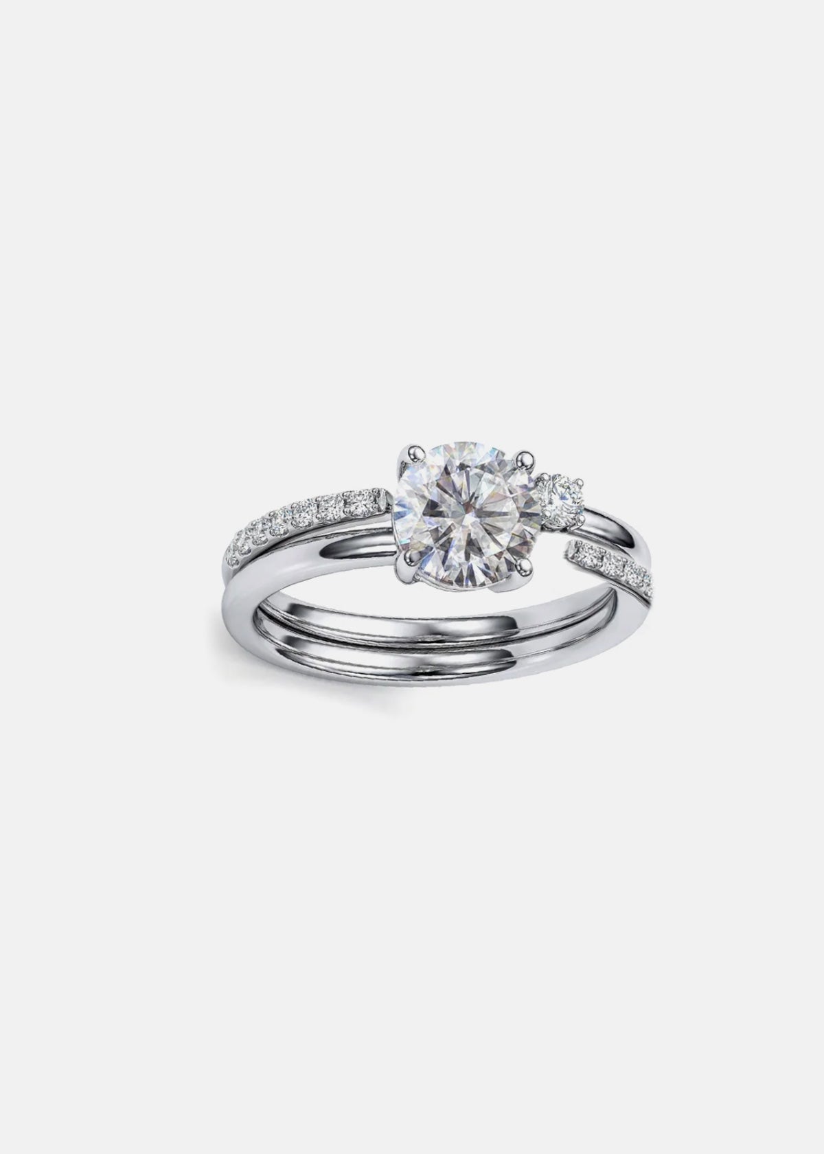 close up of  a stack of 18k white gold solitaire engagement ring featuring a floating round brilliantl diamond on a fluid, tapering open band with a round cut diamond on a white gold open band.