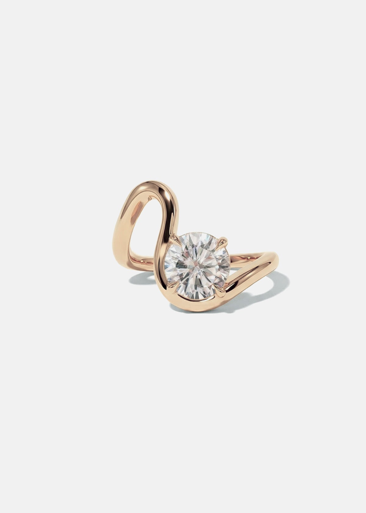 front view- a 18k rose gold ring with a unique sculptural, flowing, wavy band nestling a large round cut diamond-clean light gray background-KATKIM-engagement ring-fine jewelry