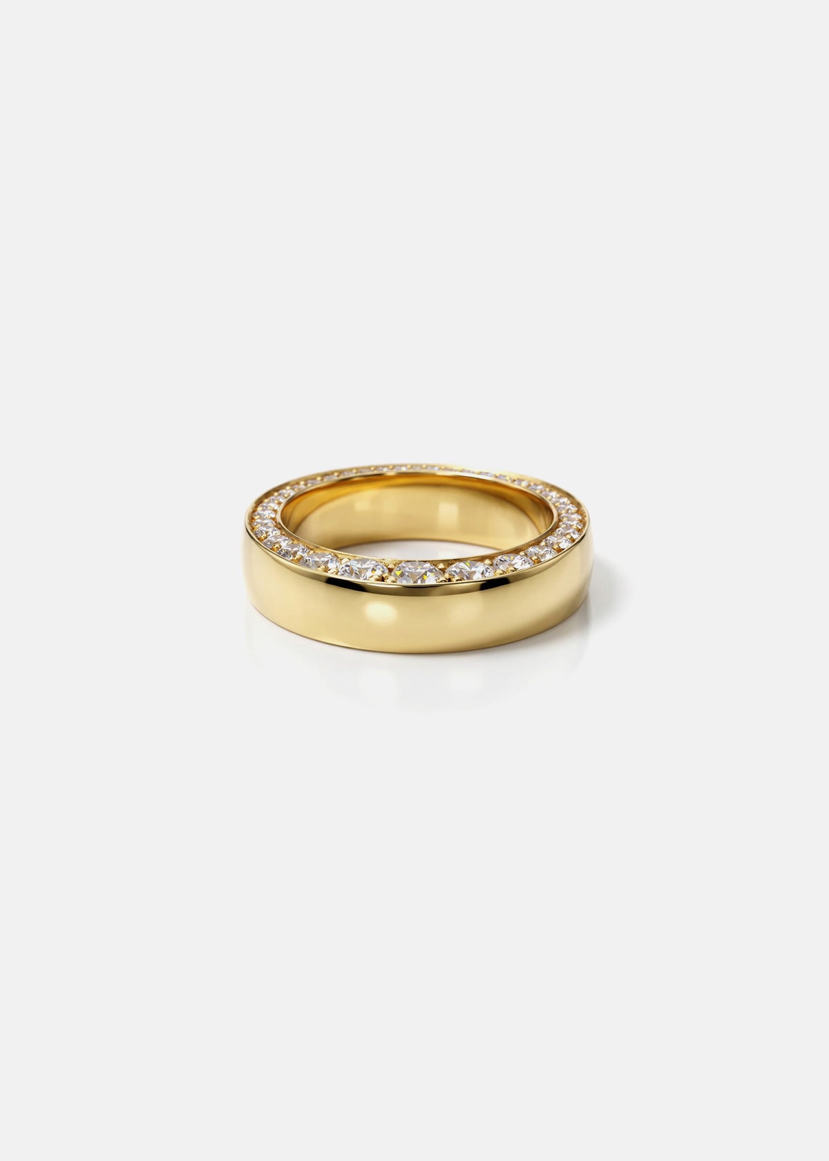 front view of a gold band with tapering diaomonds on the top.