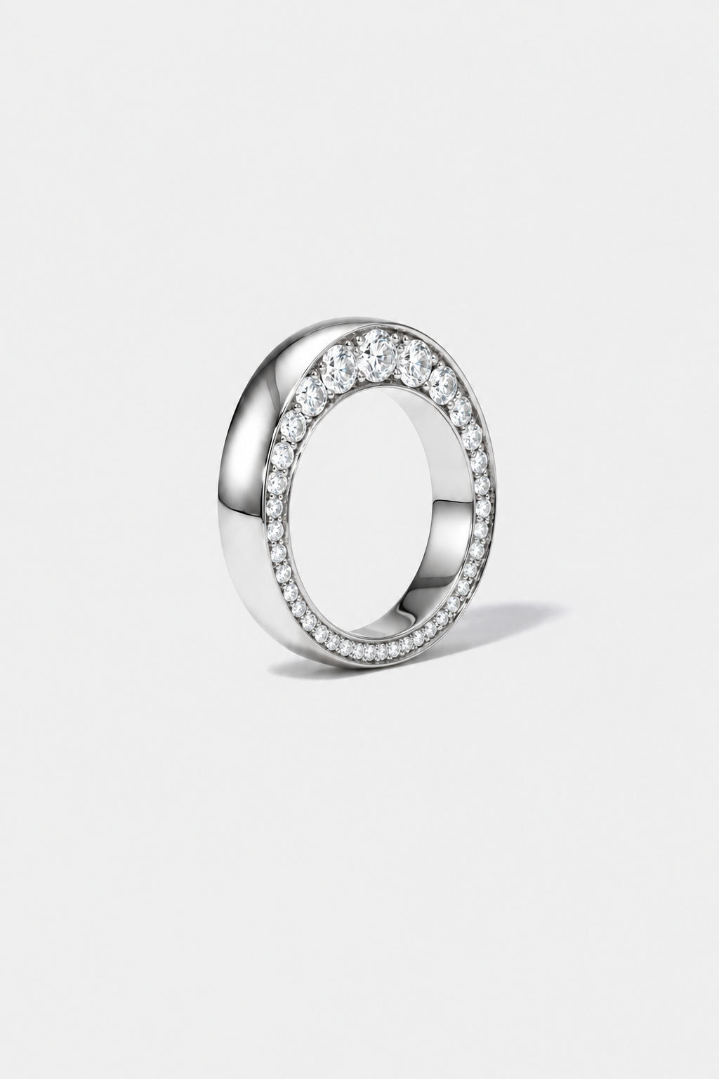 18k yellow gold ring with tapering diamonds on a white background.