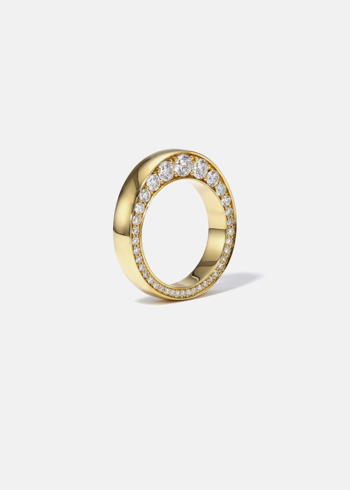 18k yellow gold ring with tapering diamonds on a white background.