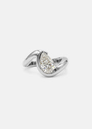 18k white gold ring featuring a pear-cut diamond in a curved, wave-like setting.