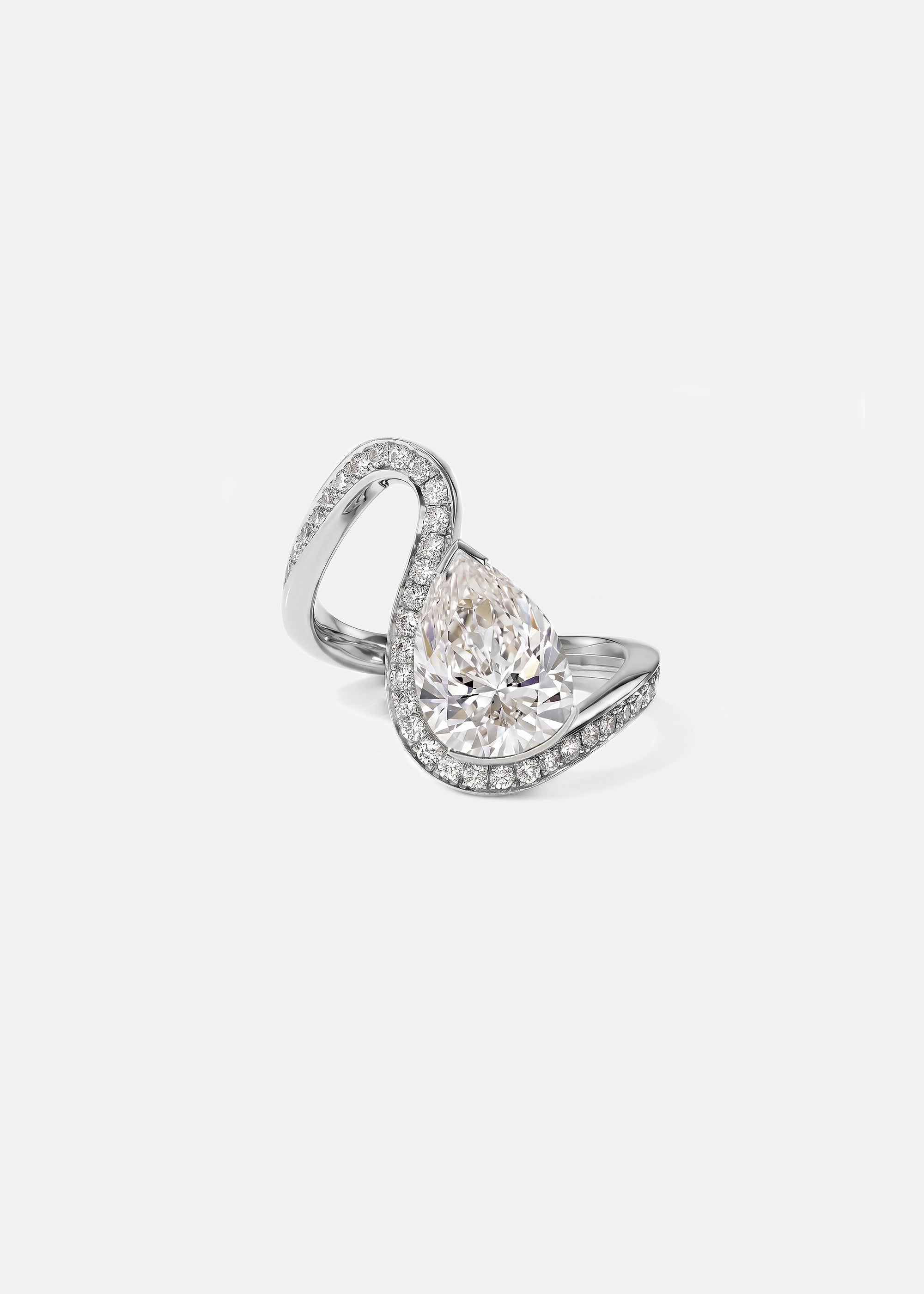 front view of a white gold wave pavé band with a pear cut diamond -18K white gold