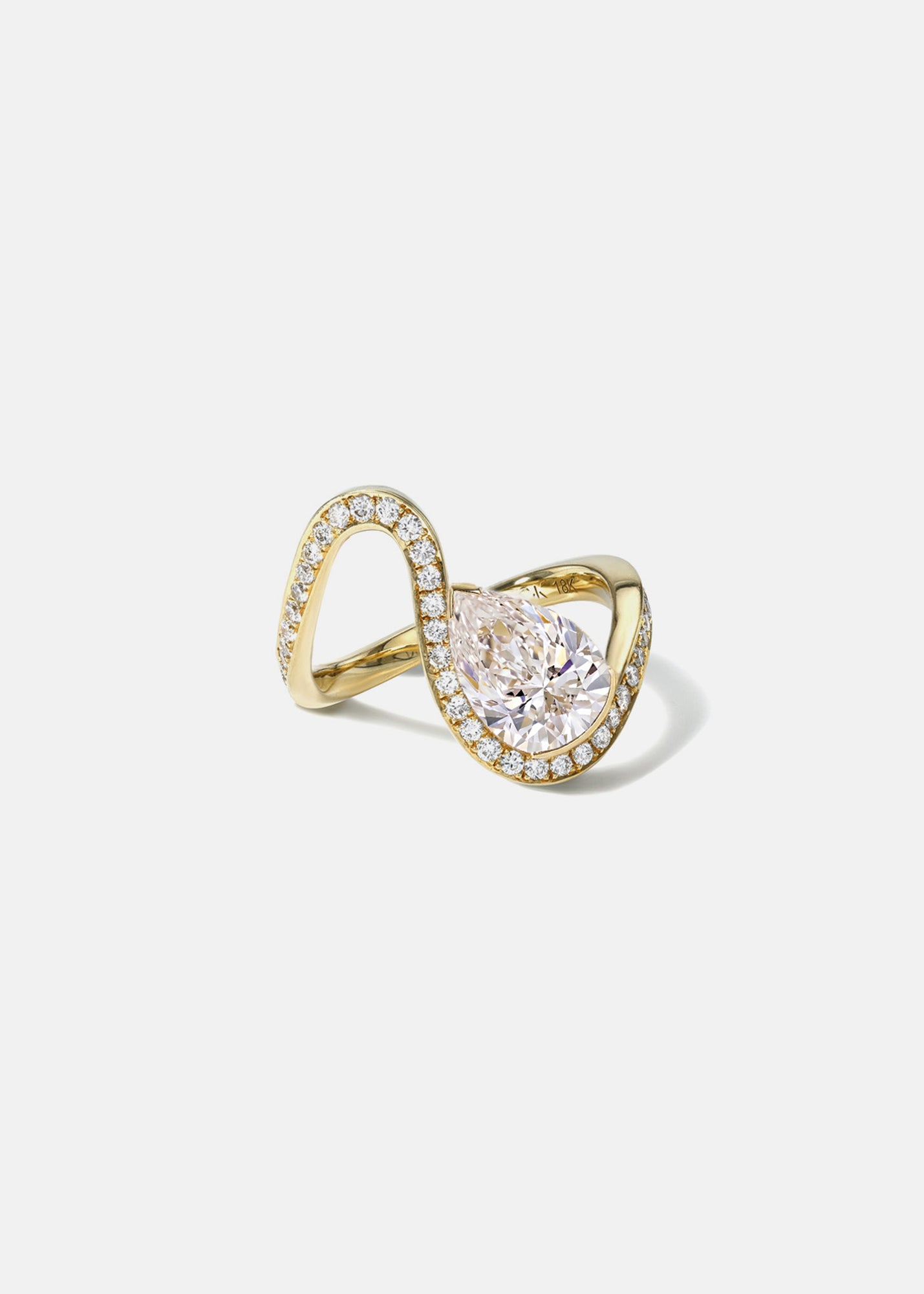 side view of a gold wave pavé band with a pear cut diamond -18K yellow gold