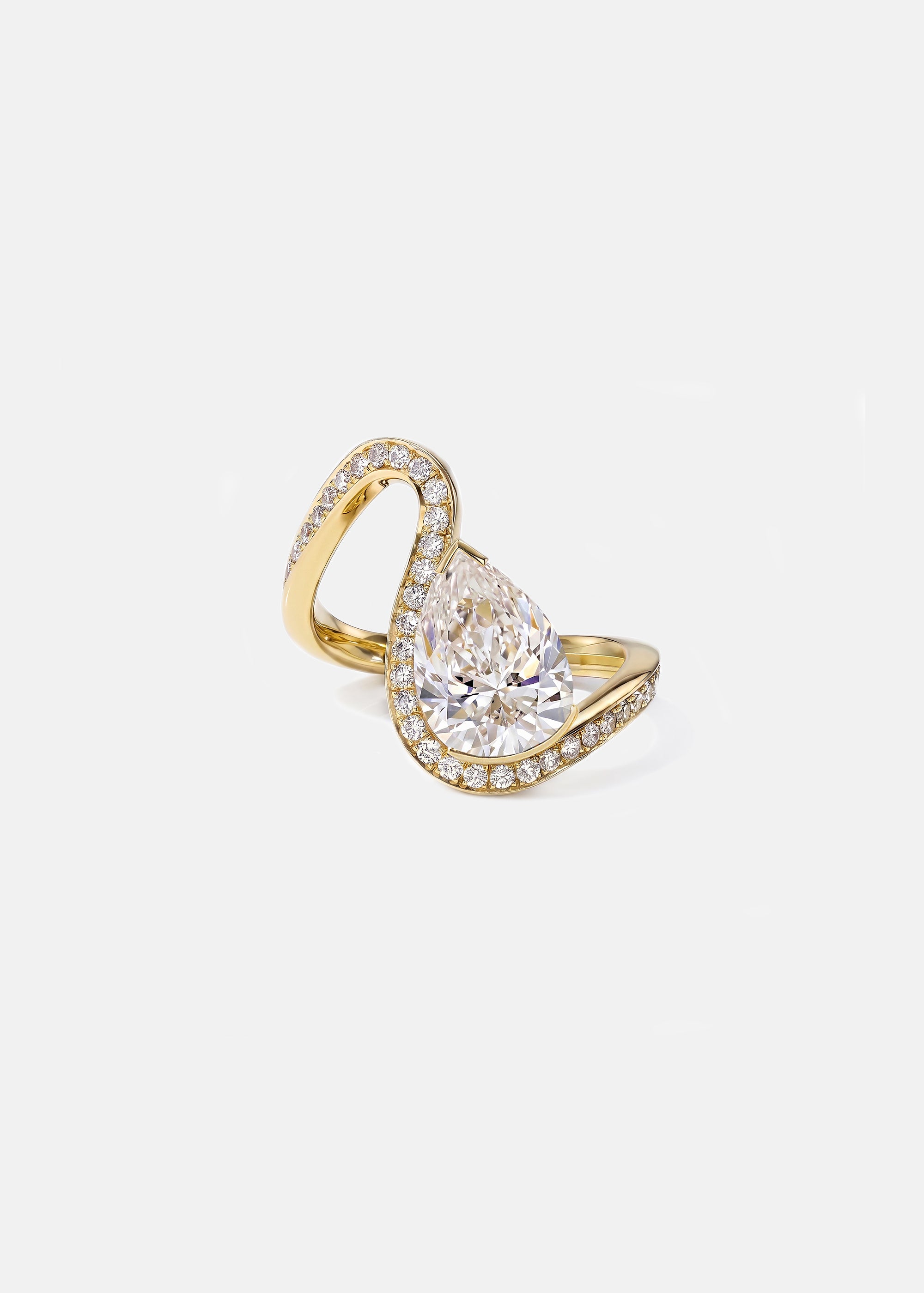 front view of a gold wave pavé band with a pear cut diamond -18K yellow gold