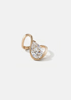 front view- 18k rose gold trace band with a floating pear cut diamond