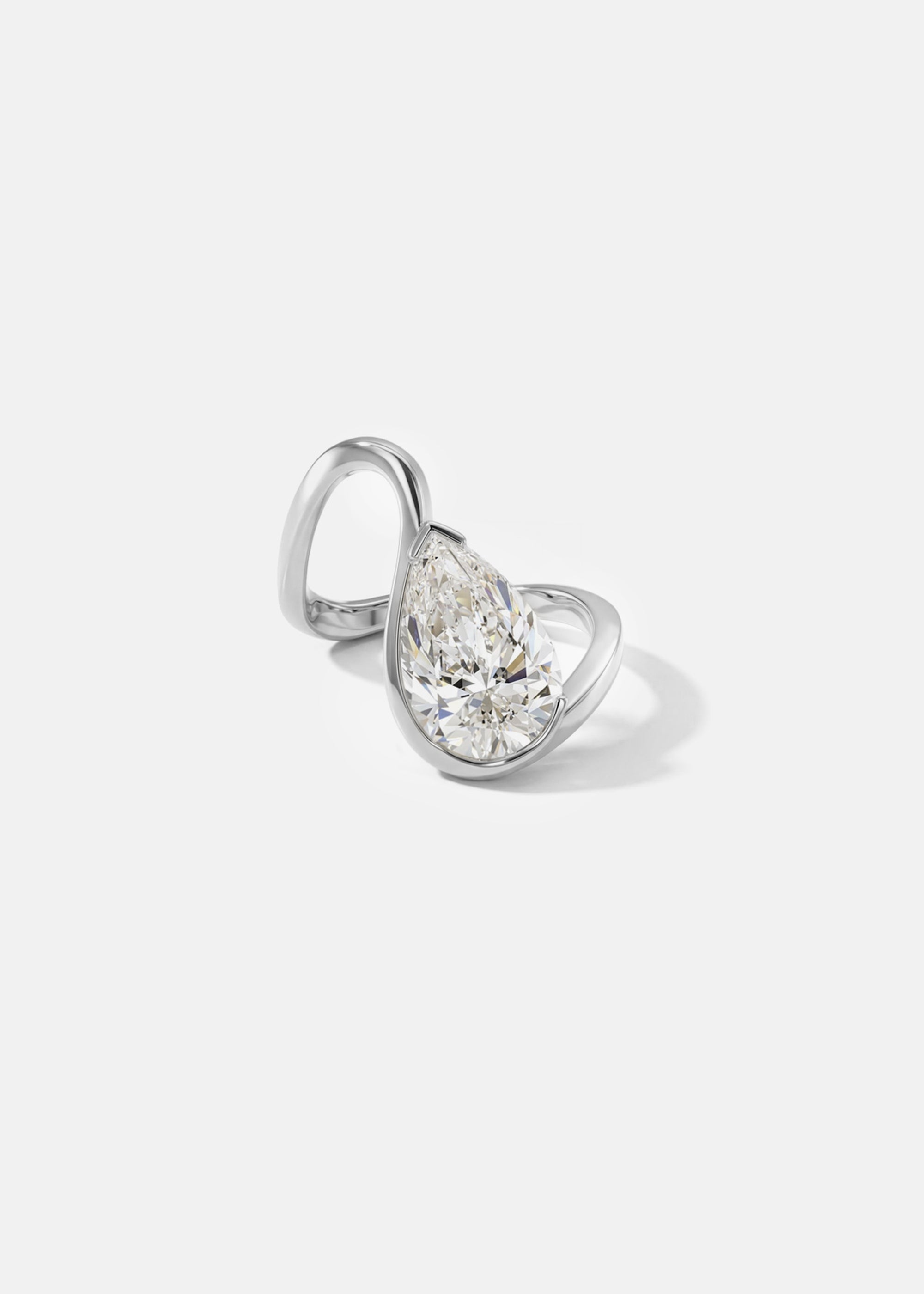 front view- 18k white gold trace band with a floating pear cut diamond