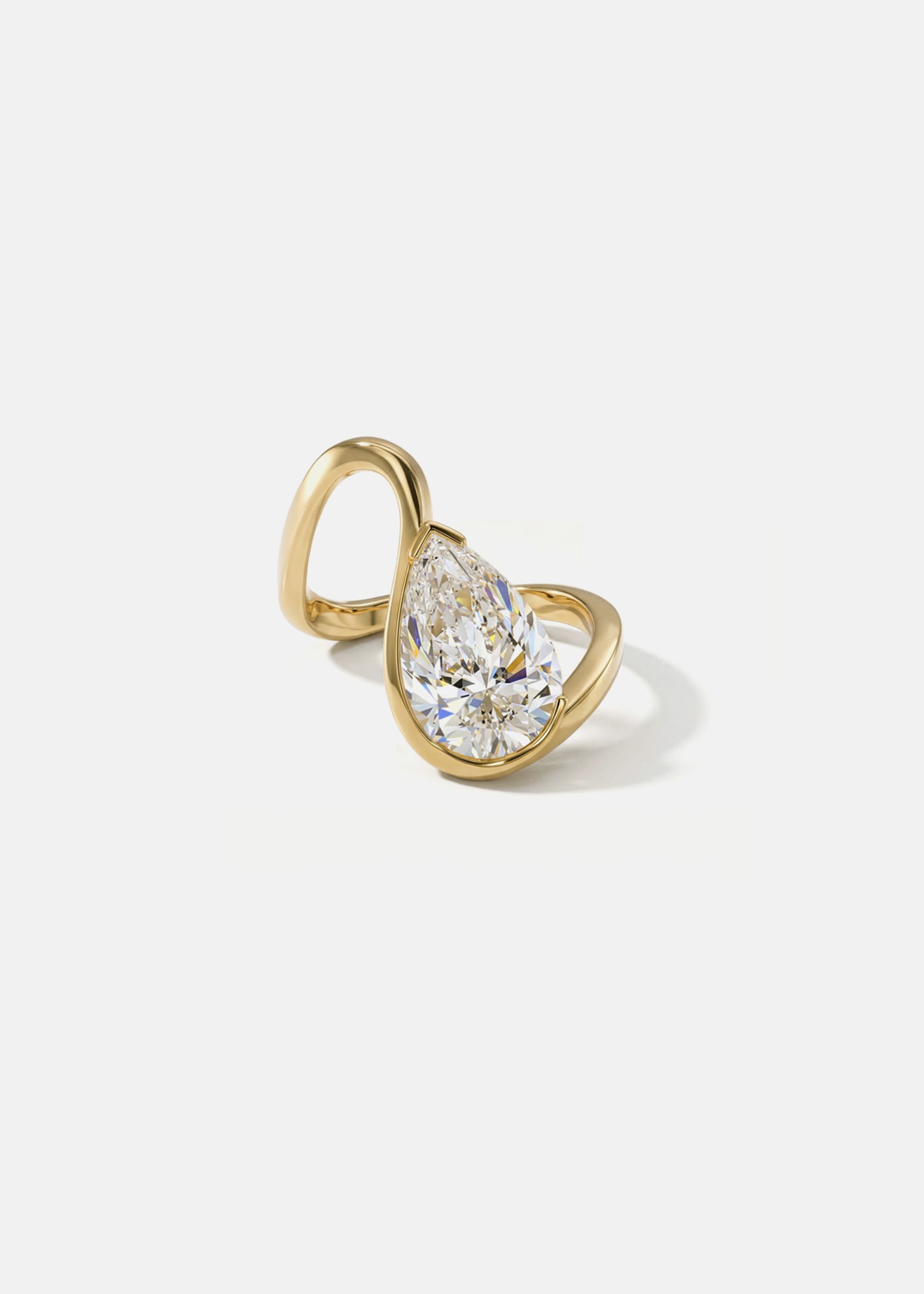 18k yellow gold trace band with a floating pear cut diamond