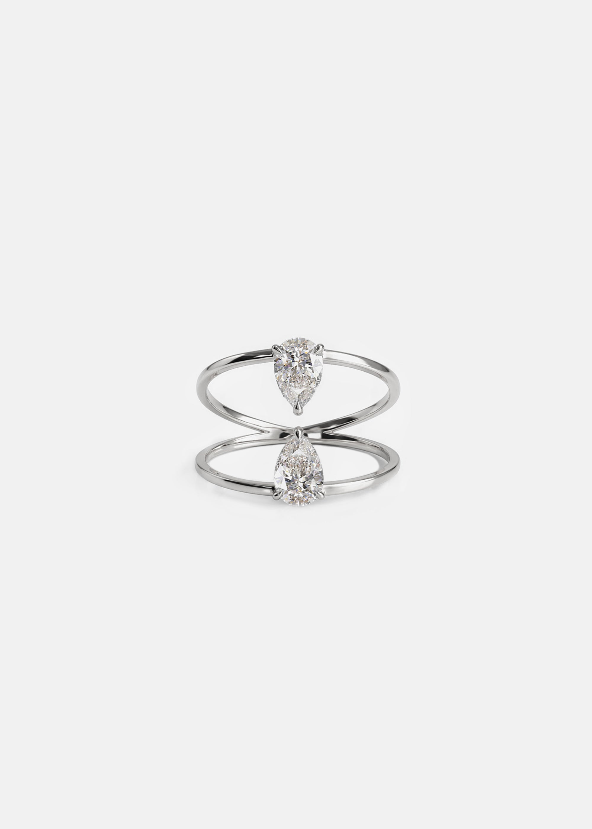 18k white gold engagement ring with two touching pear-cut diamonds facing opposite directions..