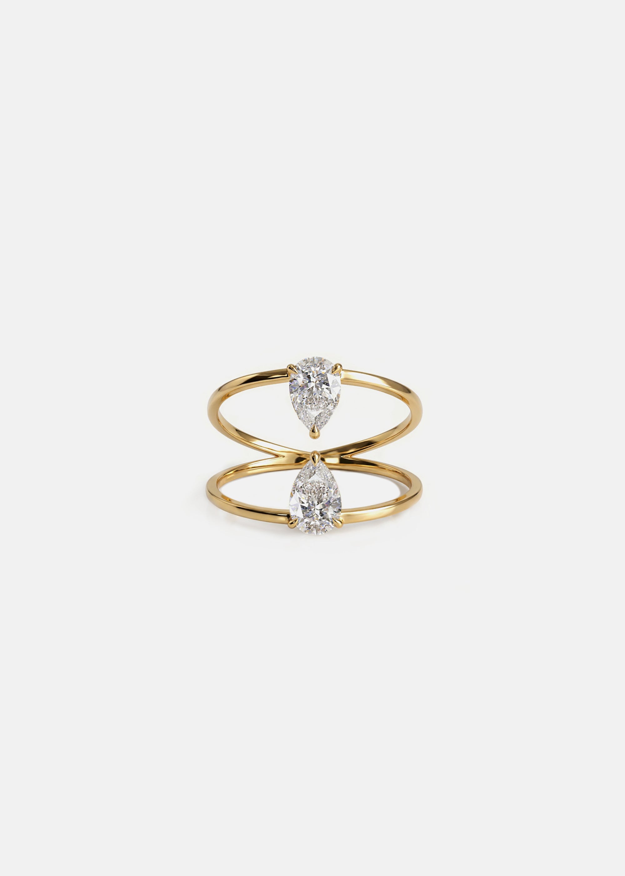 18k yellow gold engagement ring with two touching pear-cut diamonds facing opposite directions..