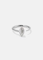 18k white gold engagement ring with a prong-set marquise diamond anchored on a fluid, tapering open band
