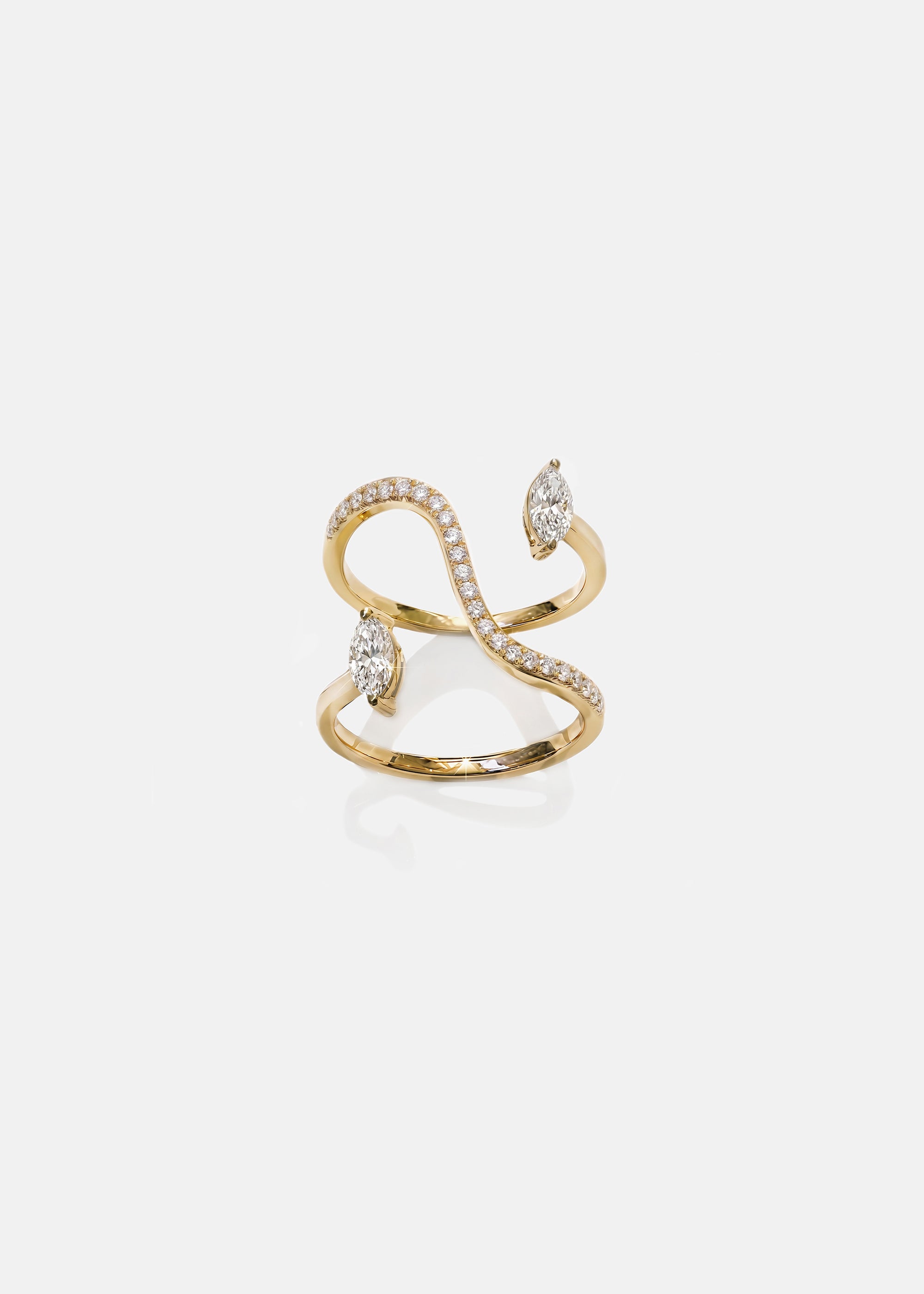 A 18k yellow gold snake-like band shape ring featuring a body paved with small round cut diamonds and two small marquise diamonds as accents.