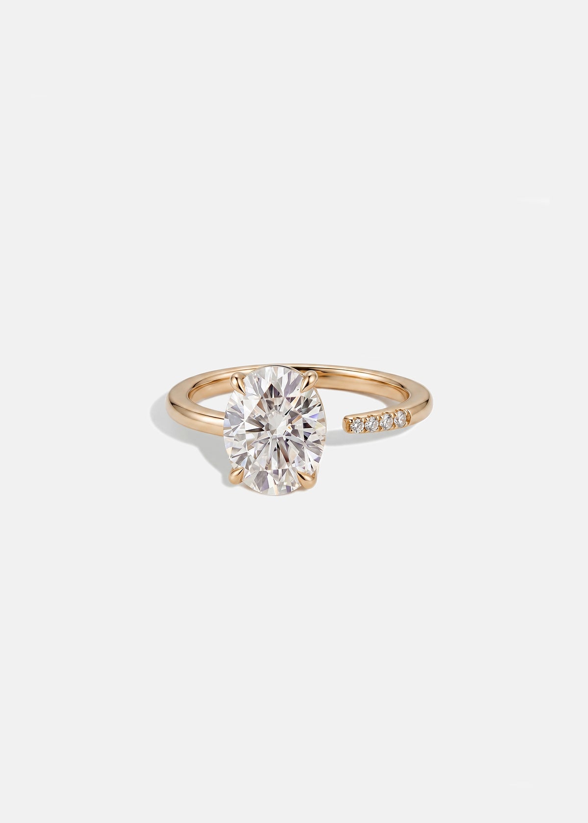 18k rose gold Brilliant Crescendo Ring with a floating oval diamond on a tapered open band