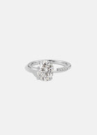 18k white gold Brilliant Crescendo Ring with a floating oval diamond on a tapered open band
