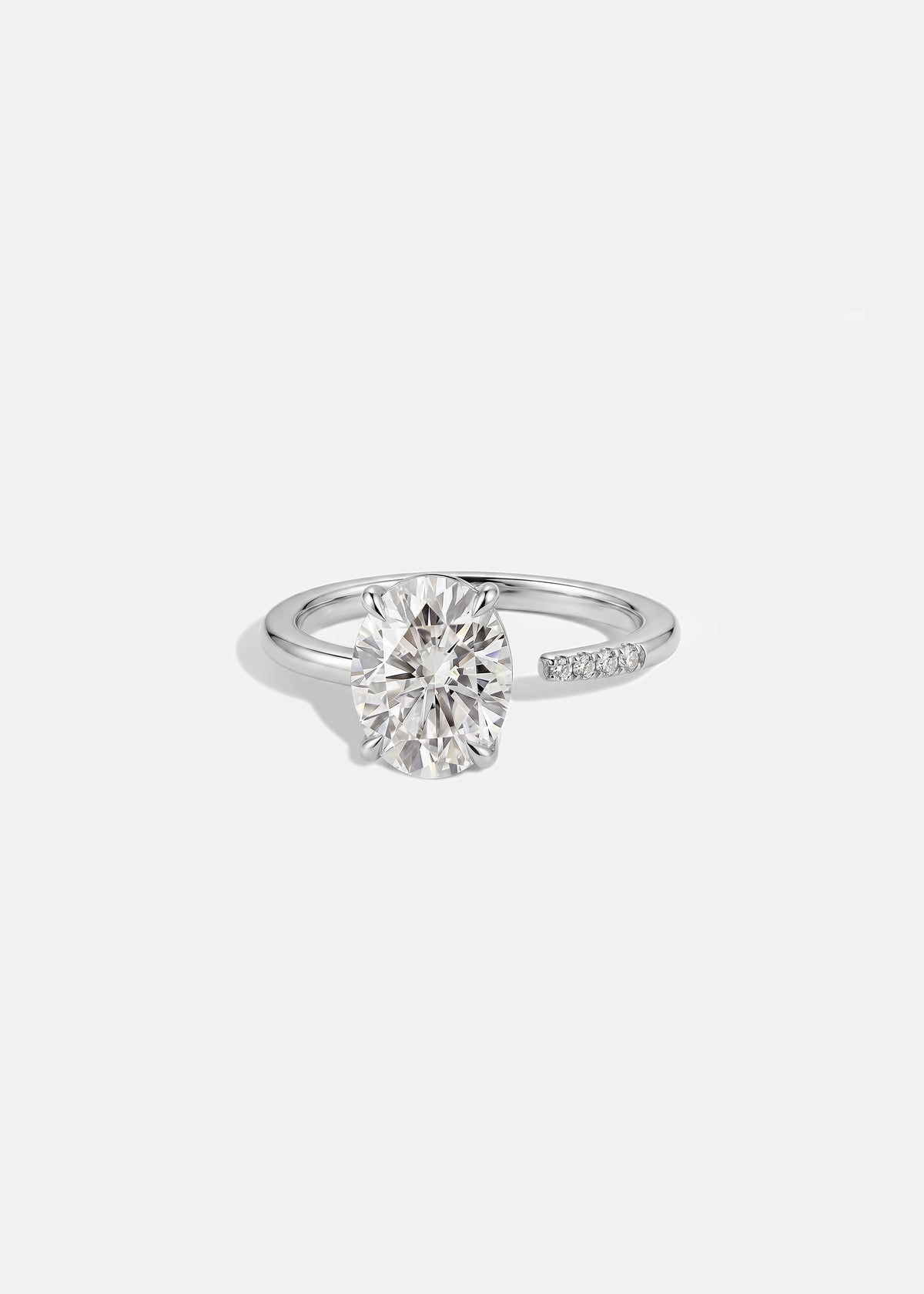 18k white gold Brilliant Crescendo Ring with a floating oval diamond on a tapered open band