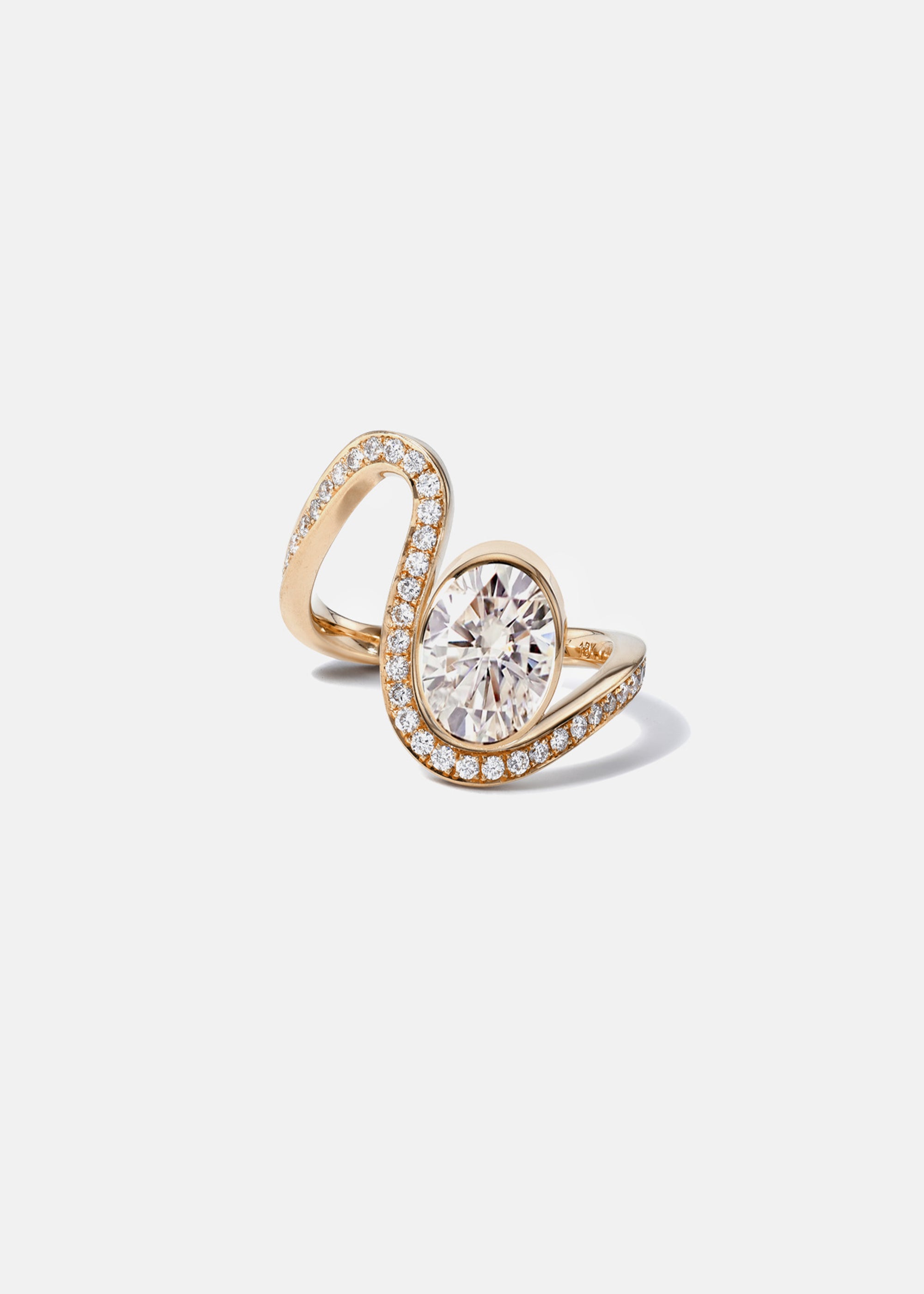 a 18k rose gold ring featuring a large oval diamond with a curved band surrounded by a halo of small pavé-set diamonds.