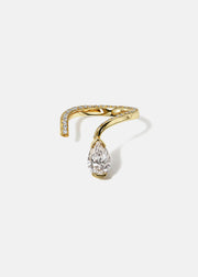A 18k yellow gold open wrap ring featuring a pear-cut diamond and a pavé diamonds along the band.
