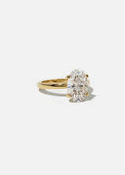 front view of a 18k yellow gold solitaire engagement ring featuring a oval cut diamond 