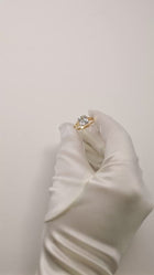 video showcasing the Asscher Diamond Cosma RIng in 18k yellow gold 