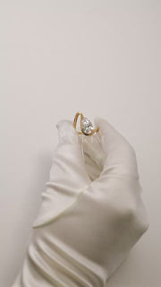 video showcasing the gold wave band with a pear cut diamond- 18K yellow gold-