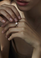 closeup of a model wearing a ring stack of 3 strcutural rings