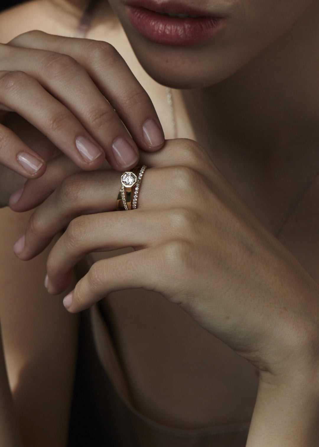 closeup of a model wearing a ring stack of 3 strcutural rings