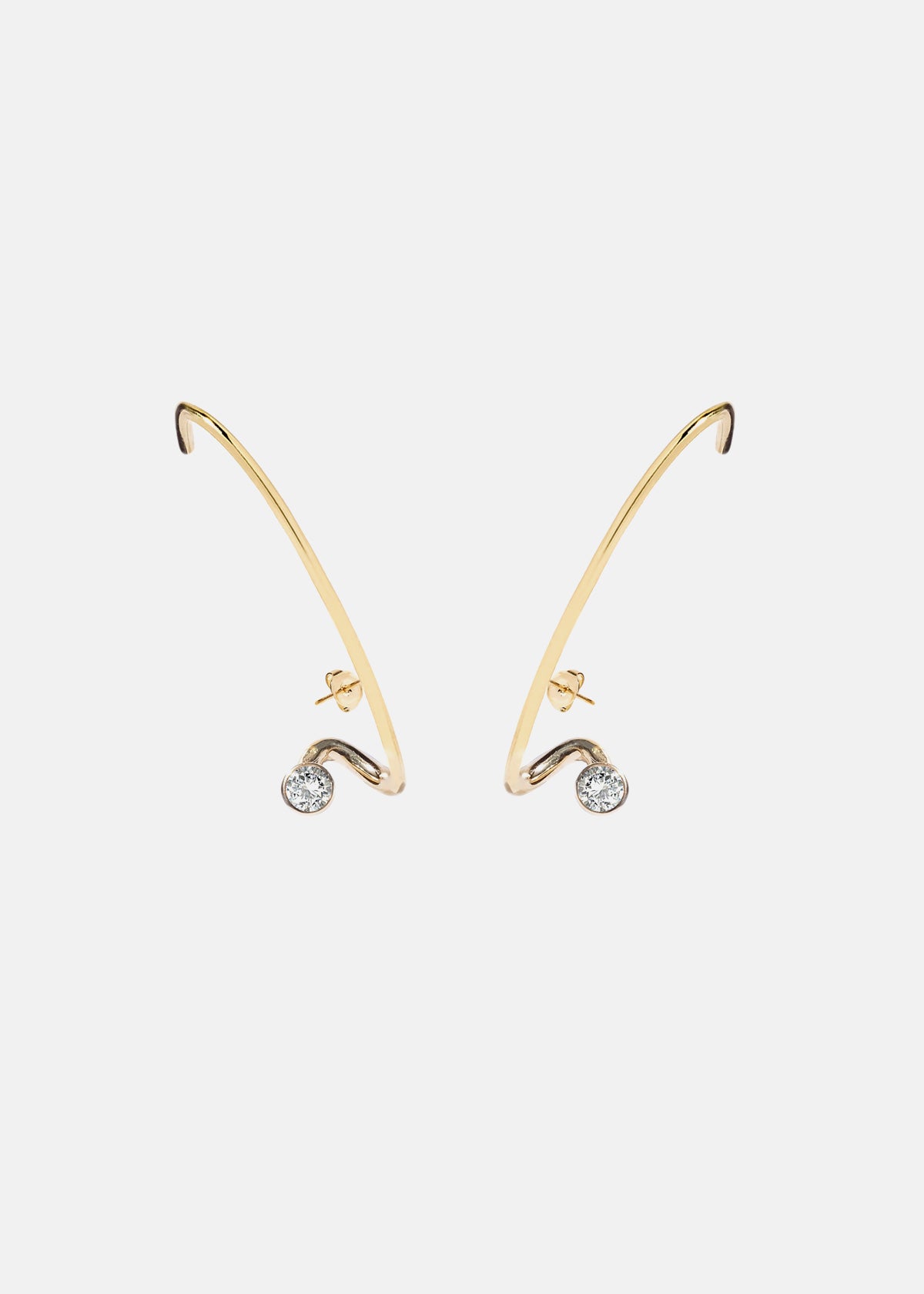 A pair of 18k gold crescendo flare earrings with a single floating diamond in the center, set in a gold frame.