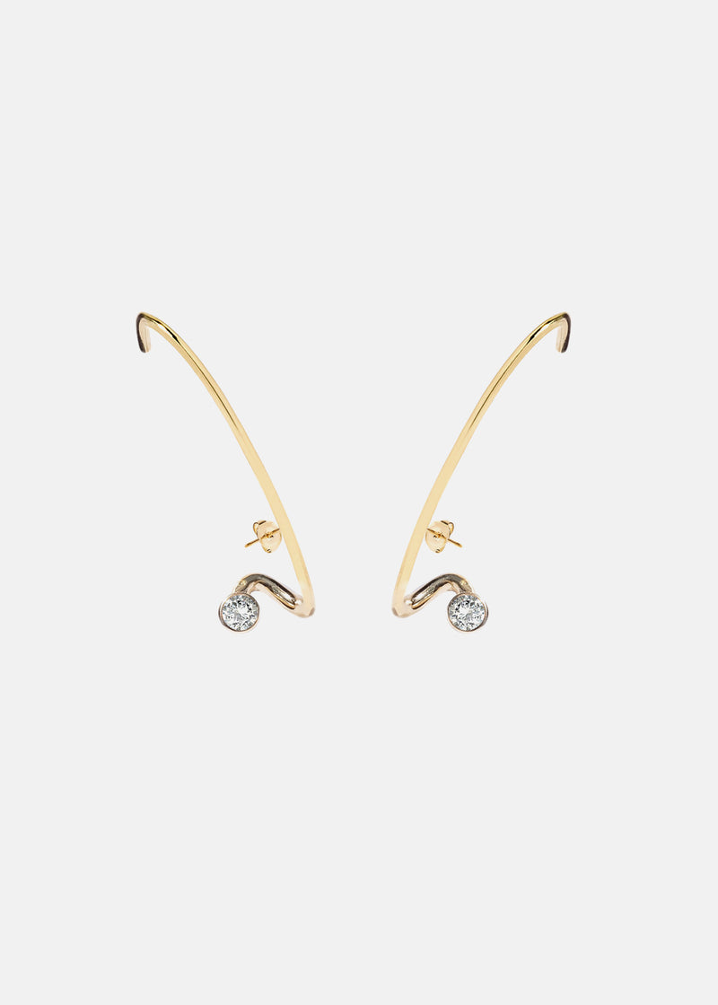 A pair of 18k gold crescendo flare earrings with a single floating diamond in the center, set in a gold frame.