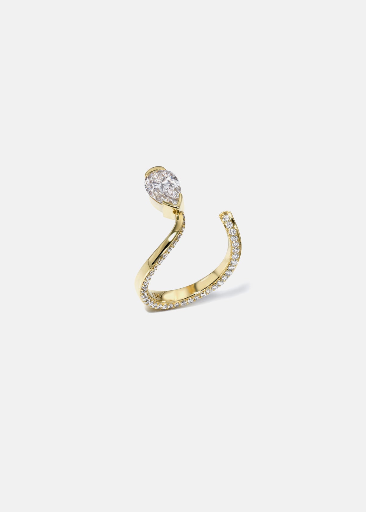 A 18k yellow gold open wrap ring featuring a pear-cut diamond and a pavé diamonds along the band.
